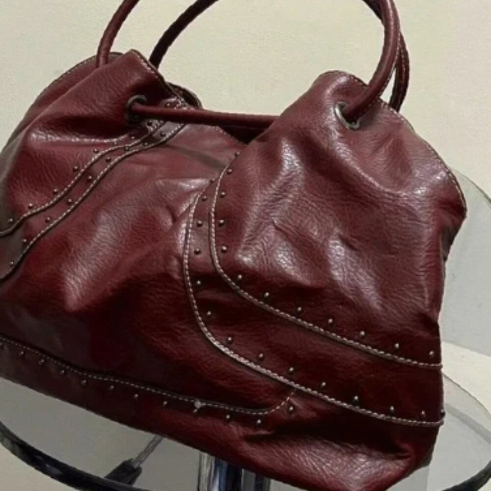 Burgundy red leather punk hobo bag with silver stud detail throughout